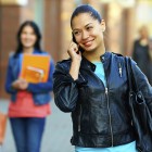 woman on phone wearing leather jacket