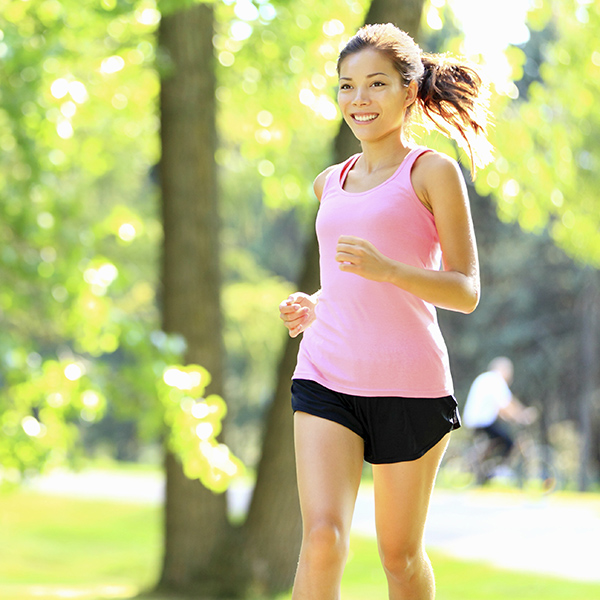 Runner - woman running in park
